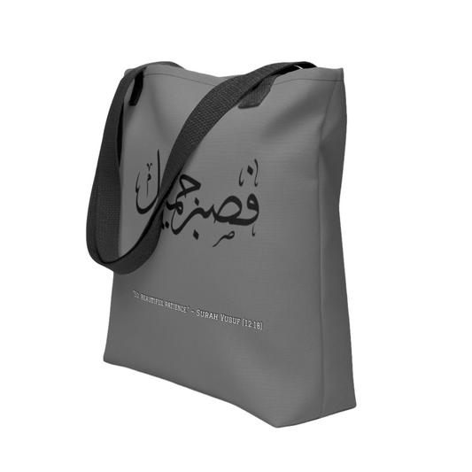 Gray tote bag with black text on a white background